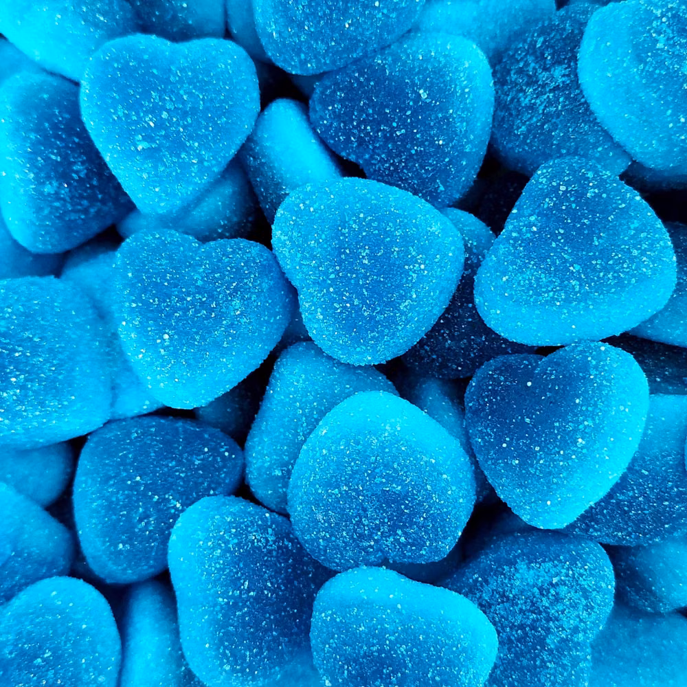 blue gel candy translucent macro photograph - 💙 Jelly Filled Blue Hearts! 💙 These are a recent arrival from Spanish manufacturers, Damel. They have a super intense Raspberry flavour with a soft jelly centre! They also come in Strawberry flavour.... 🍓 Available now 😍