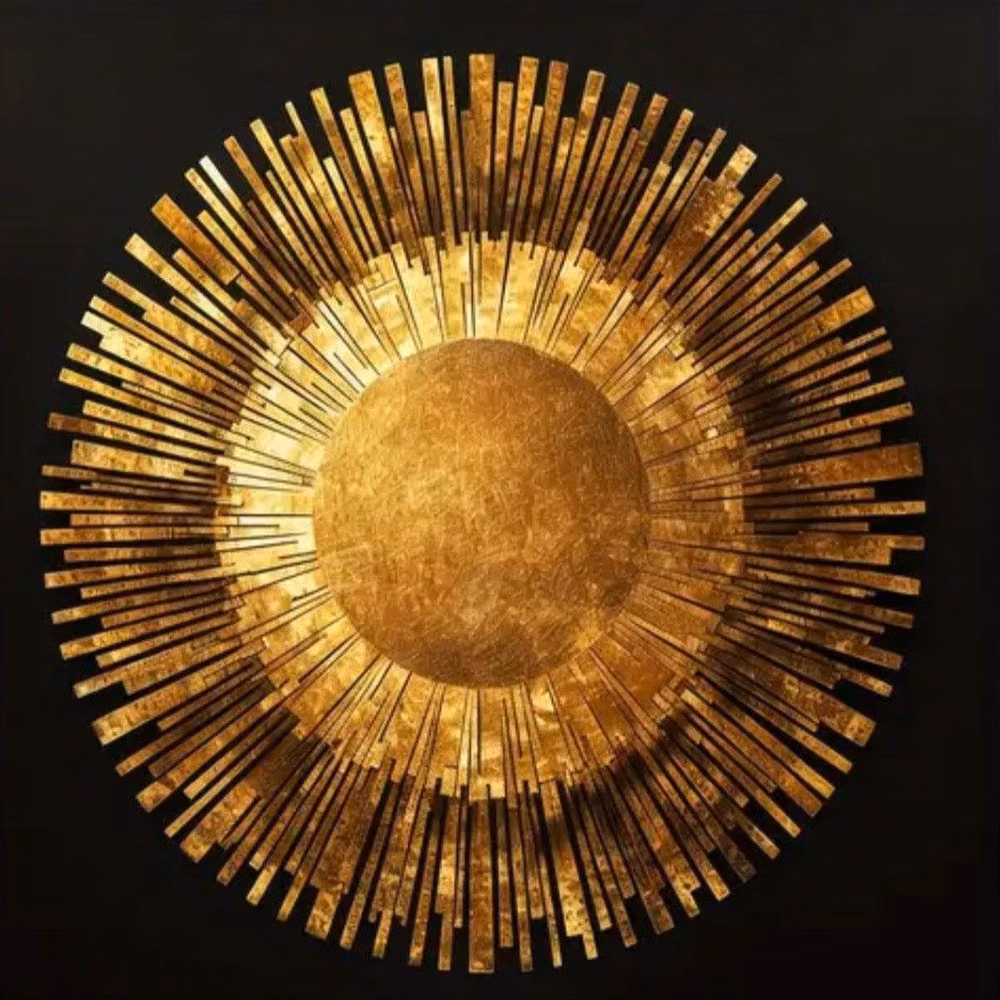 brass sunburst object close up photograph -