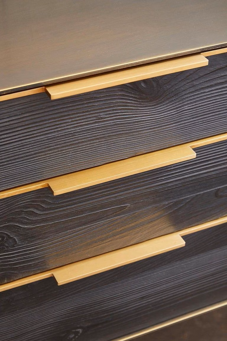 black lacquer brass geometric detail photograph -
