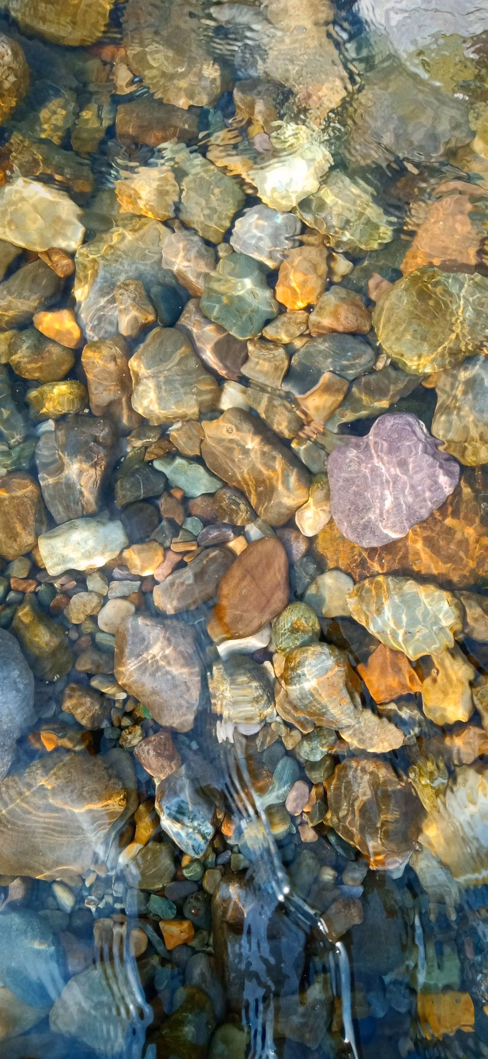 clear flowing stream stones close up photograph -