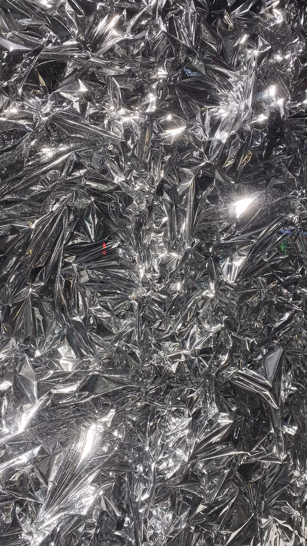crumpled aluminum foil reflective macro photograph -