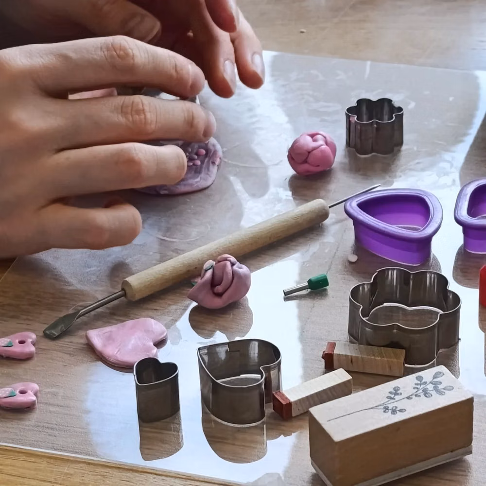 colorful clay modeling tools overhead photograph - Polimer clay jewellery workshop! 🩷 Last Sunday I gave my very first Polimer clay workshop. It was quite special for me as Polimer clay has been a medium I've been coming back to since childhood. Some of my very first jewellery pieces were made out of it and I love the endless possibilities and ways to work with it. Thank you to my lovely participants for spending the moody autumn Sunday morning with me! 🤗✨ Would you like to try working with Polimer clay? 😁💕