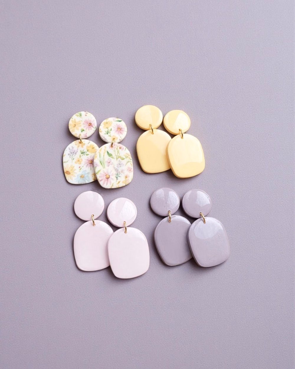 pastel polymer clay pieces studio photograph - Spring Collection Meet Giselle, in a spring colour palette. Perfect for every day but also for a unique outfit. They are more designs available! Have a look on my shop Available colours ♡ Buttercream Yellow ♡ Pink ♡ Lavender ♡ Floral Total Length : 40mm Stainless steel posts. These polymer clay earrings are handmade in London by me. Due to their handmade nature, there may be slight variations compared to the picture and there may be minor imperfections in each piece. If your favourite colour is not listed , please contact me and I will do my best to help you! Care Tips - Store in a clean, dry place. Use of oils, creams, perfumes etc may affect longevity. Do not wear in water. - To clean polymer clay pieces, rub gently with a soft, wet piece of cloth. If you own a white or light colore