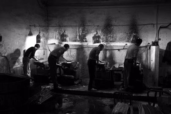 historic factory workers black white photograph -