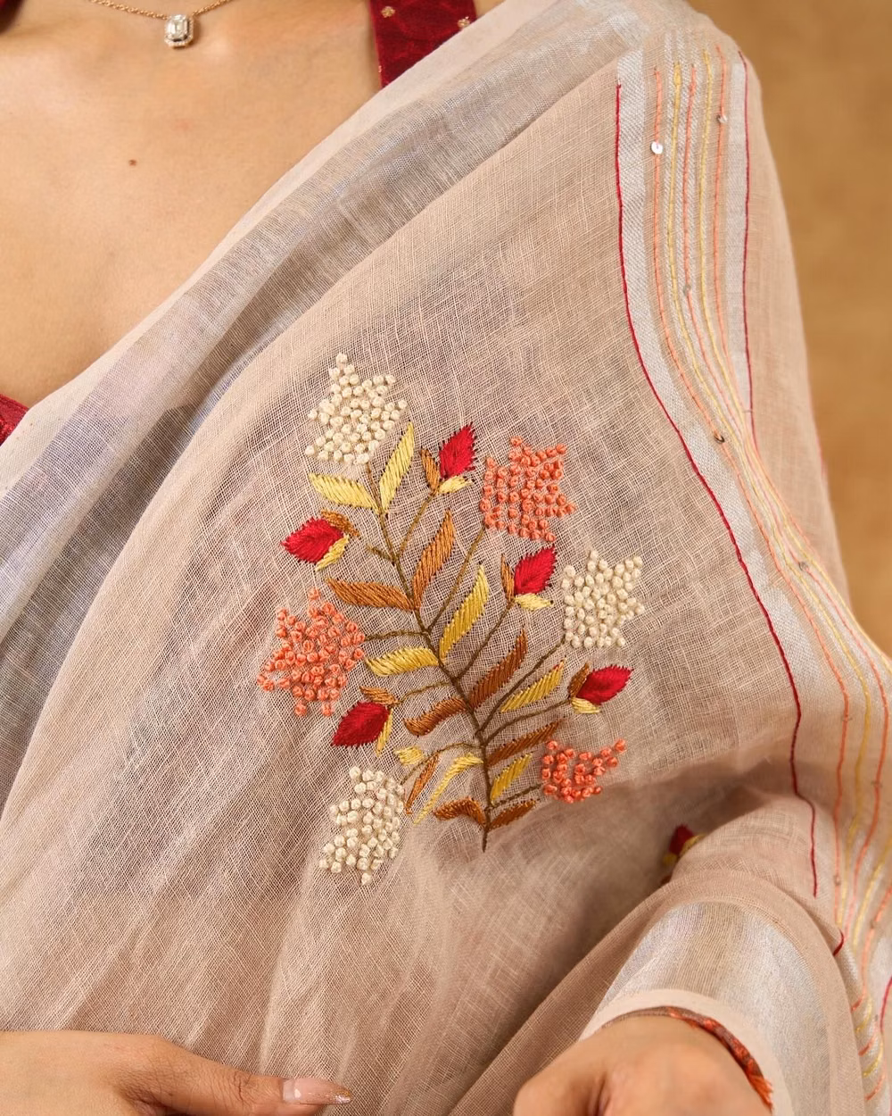 hand embroidery floral linen close up photograph - Discover the timeless beauty of our Exclusive Pure Linen Hand Embroidered Saree With Floral Motifs. Crafted with expert precision and delicate embroidery, this saree is perfect for any occasion. Enjoy the luxurious feel of pure linen while showcasing the intricate floral motifs that add a touch of elegance. #sujatra #sujatraglobal #sujatrasarees #sareelove #purelinen #purelinensarees #linensarees #handembroidery #handembroideredsaree #floralsaree #floralmotif #floralembroidery #elegantsarees