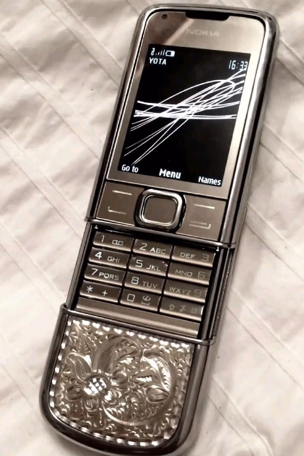 silver flip phone product photograph - Λ casey lordan - boys of tommen