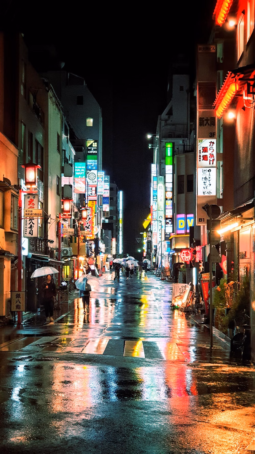 dense Japanese city signs rainy night photograph - Rainy night in Ikebukuro