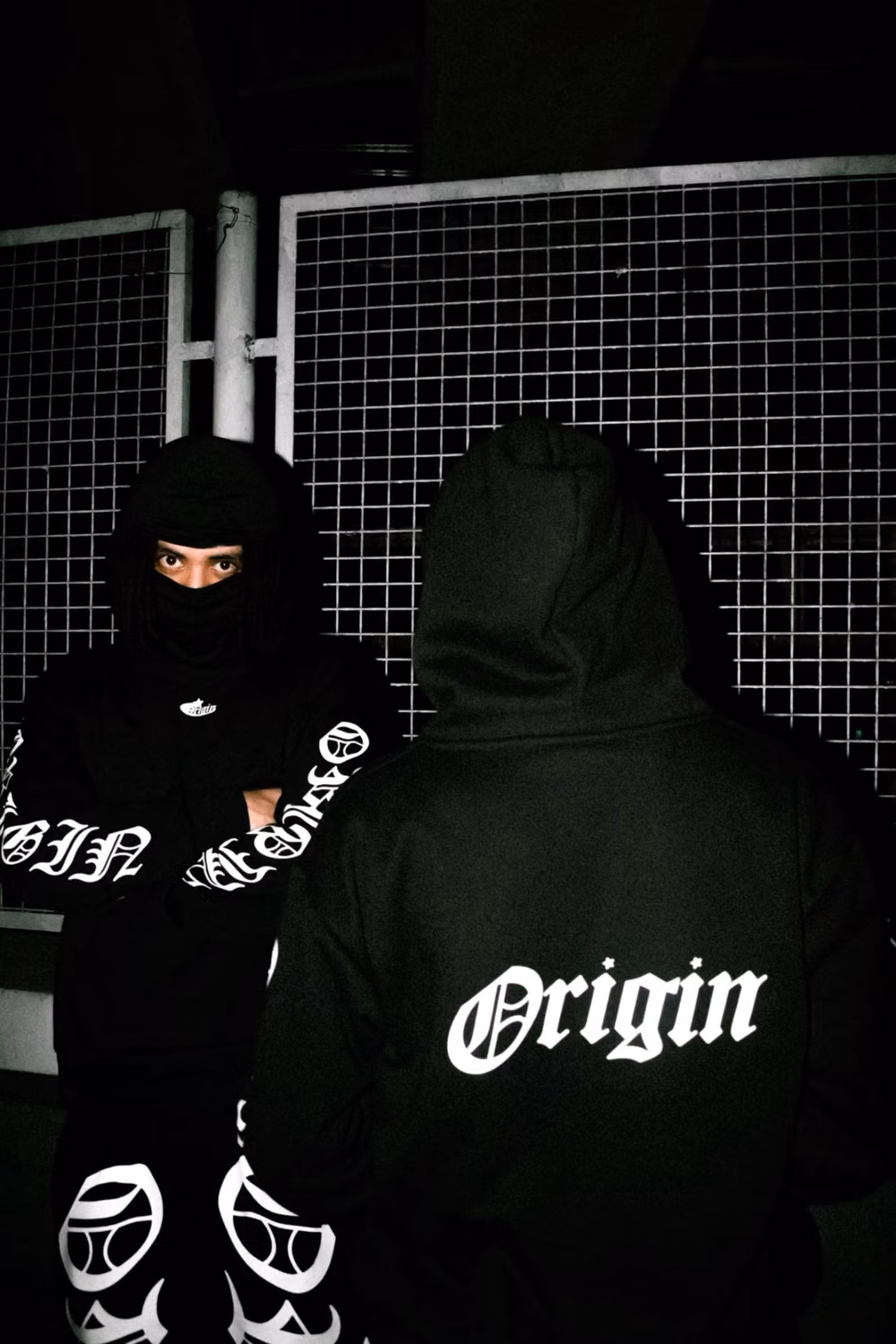black technical streetwear outfit night photograph -