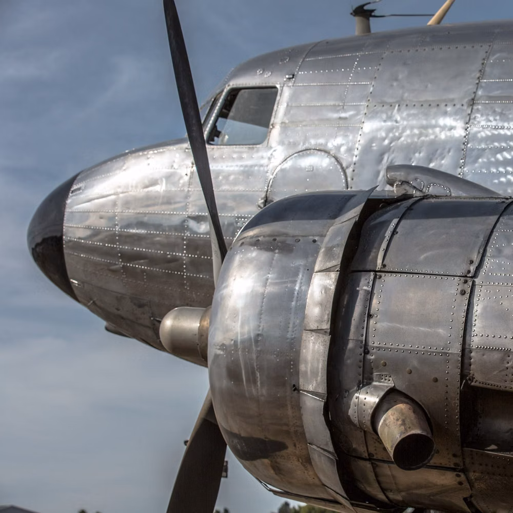 riveted 1930s aircraft fuselage close up -