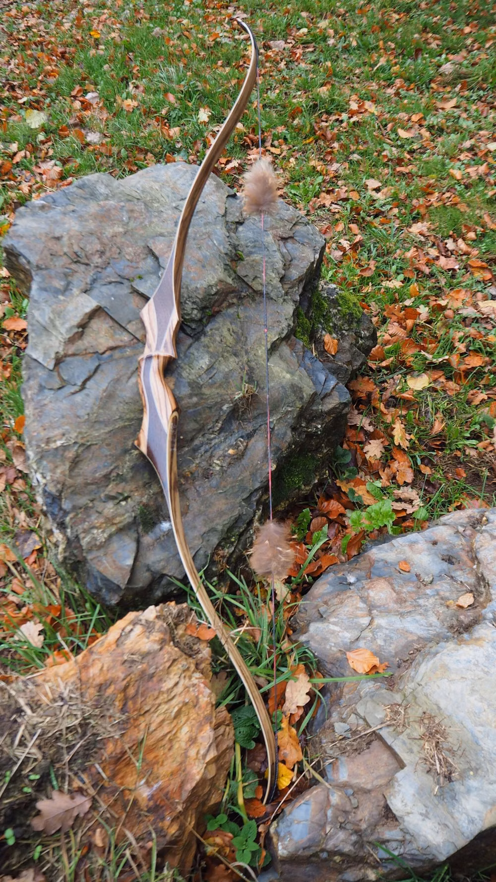 handcrafted wooden longbow detail photograph -