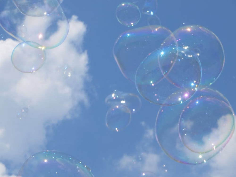 soap bubbles blue sky photograph -