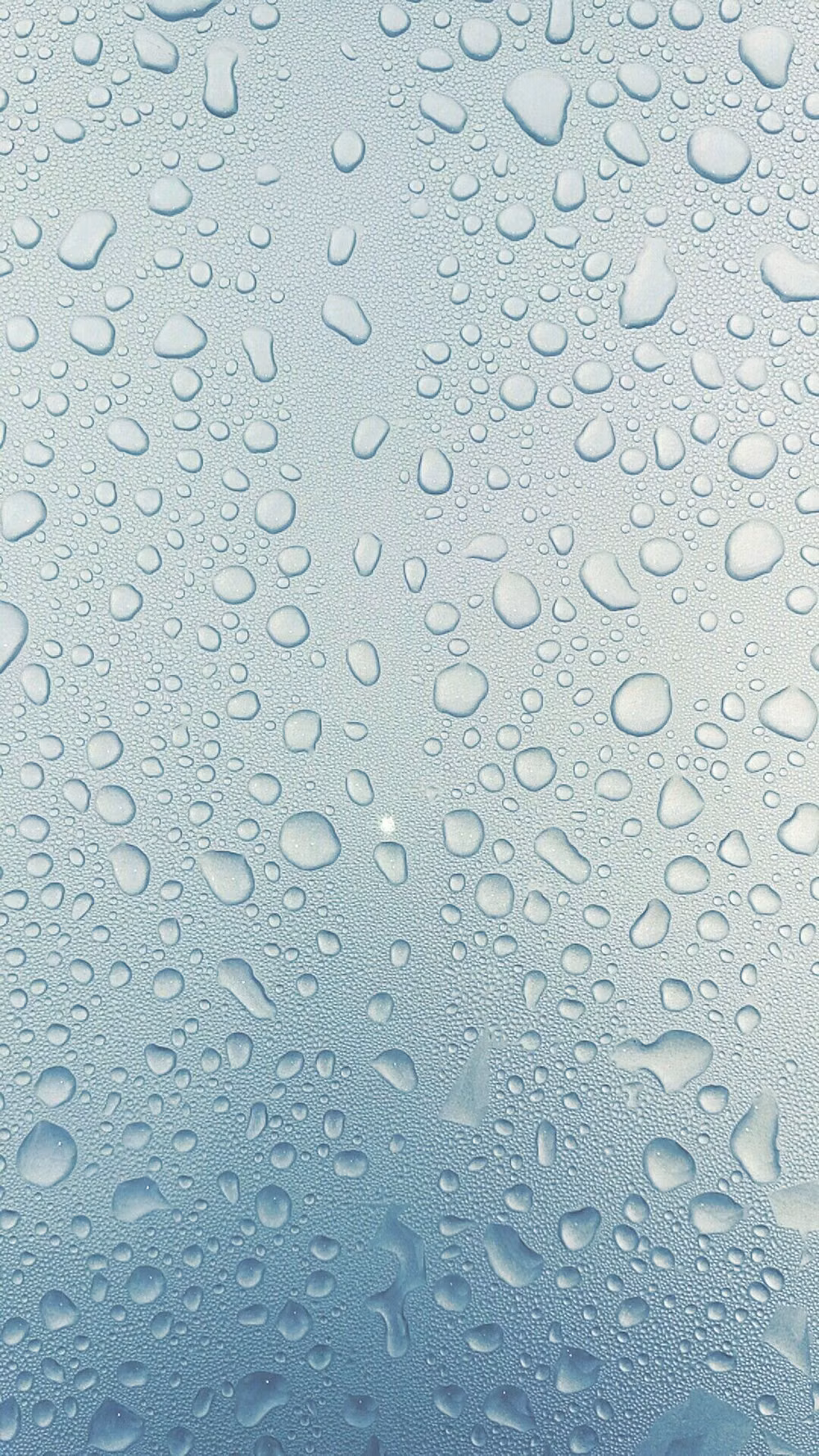 condensation droplets on glass macro photograph -