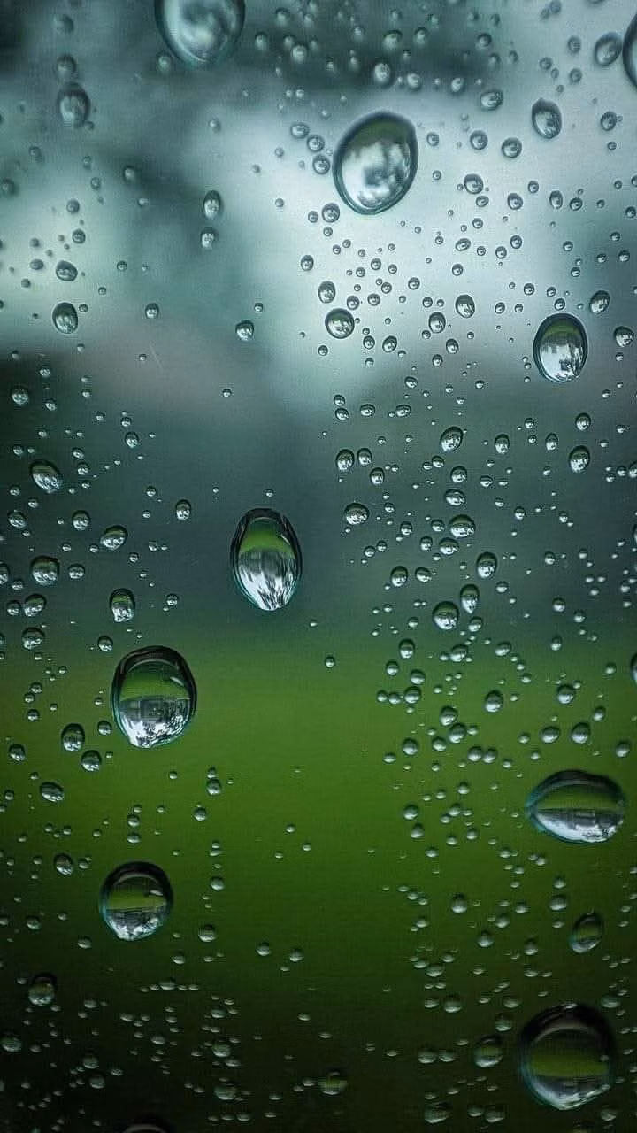 condensation droplets on glass macro photograph -