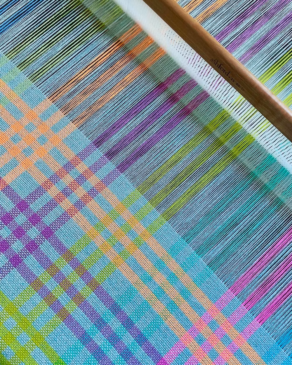 handwoven colorful textile loom photograph - New on the loom 🩷💛🩵 Pure cashmere . . #handwoven #handwoventextiles #handweaving #handwovenscarf #cashmere #cashmerescarf #cashmereshawl #brightandbold