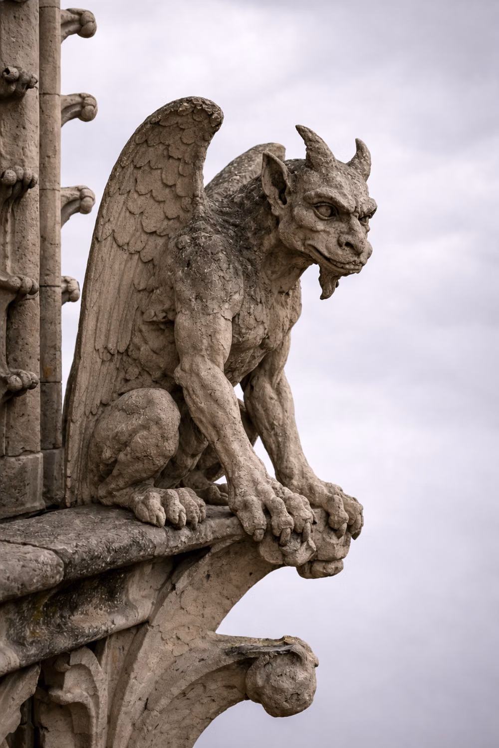 weathered stone gargoyle close up photograph -
