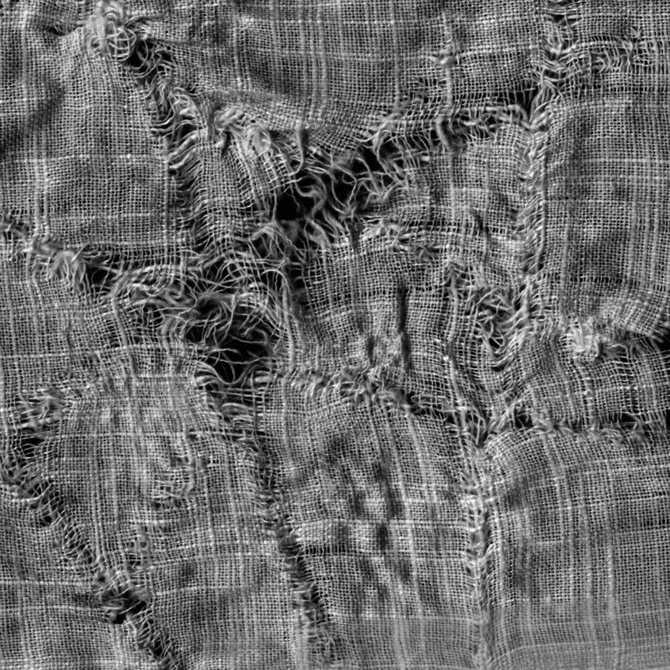 distressed black denim fabric macro photograph - Distressed Fabric Close up