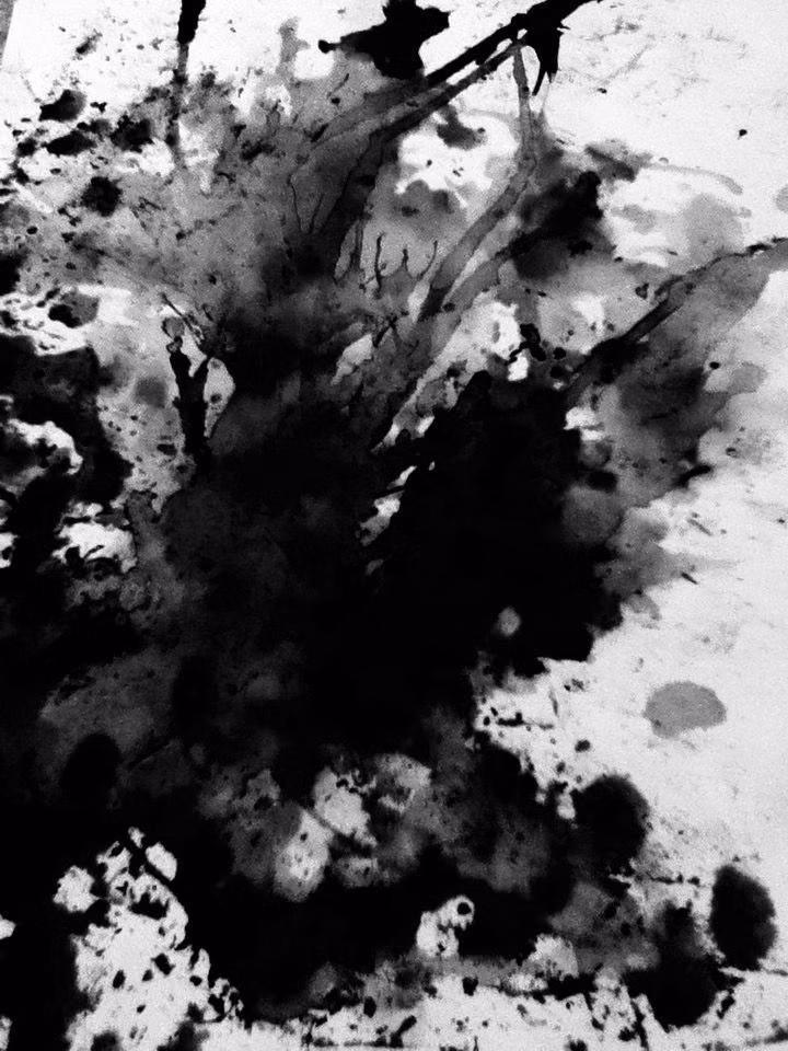black printing ink splatter paper photograph -