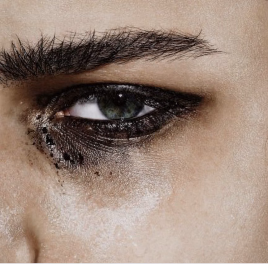 smeared black eyeliner close up photograph -