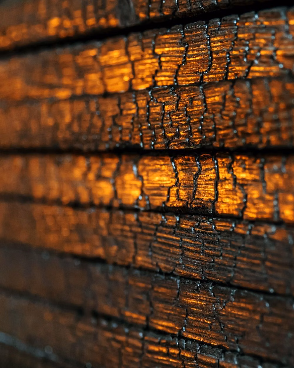 charred cedar yakisugi texture close up - Traditional technique, timeless beauty.  #StudioTsukuru #Melbourne #Yakisugi #CharredWood #WoodTexture #ArchitecturalDetail #SustainableMaterial #TraditionalTechnique #MaterialArt #DesignDetail