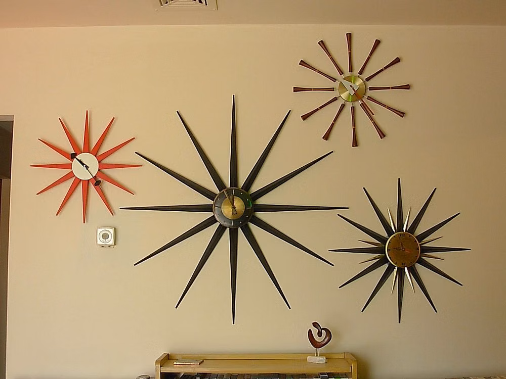 atomic starburst wall clock photograph - I like this idea - a wall of starburst clocks