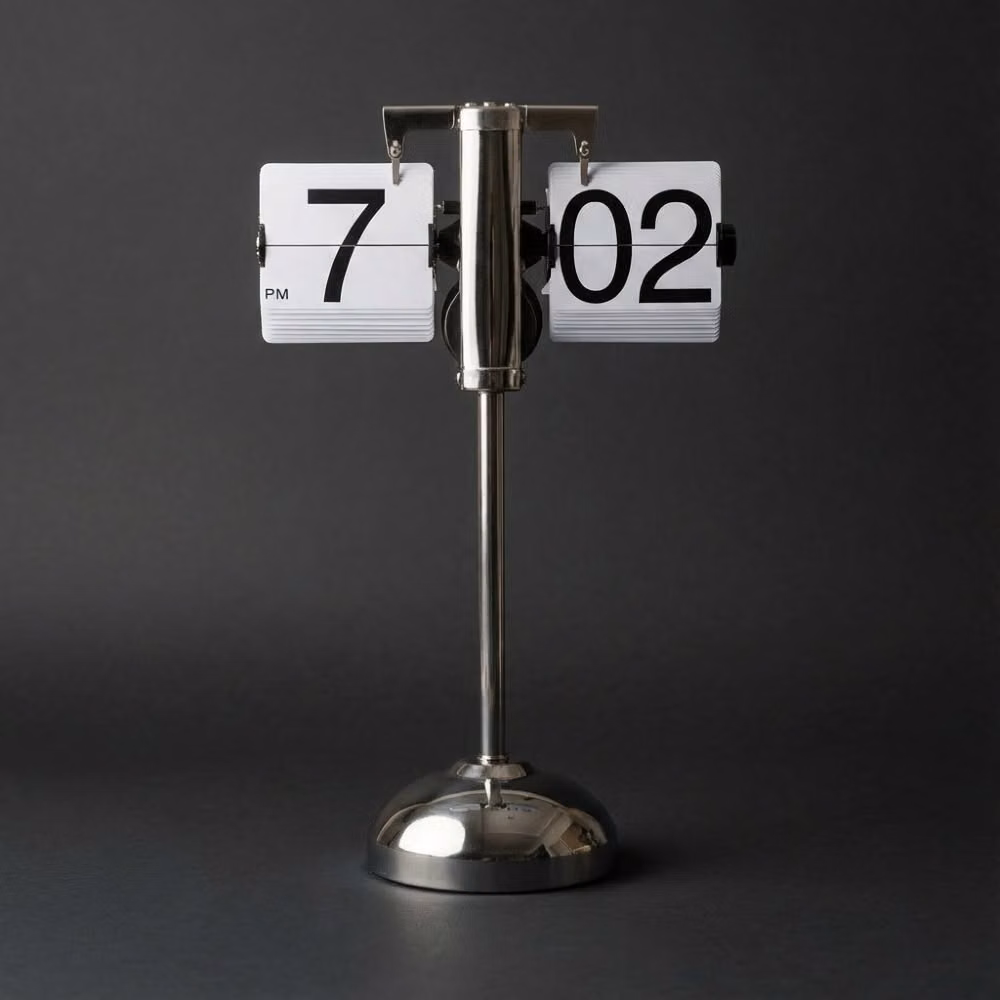 mechanical flip clock changing number photograph - Timeless design for the modern home. There’s something deeply satisfying about the tactile "click" of a flip clock—a mechanical heartbeat in a digital world. The Stainless Steel Stand clock from @timewillflip is more than a timepiece; it’s a statement. #TimeWillFlip #FlipClock #InteriorDesign #MinimalistHome #DeskSetup #MidCenturyModern #HomeDecorInspo