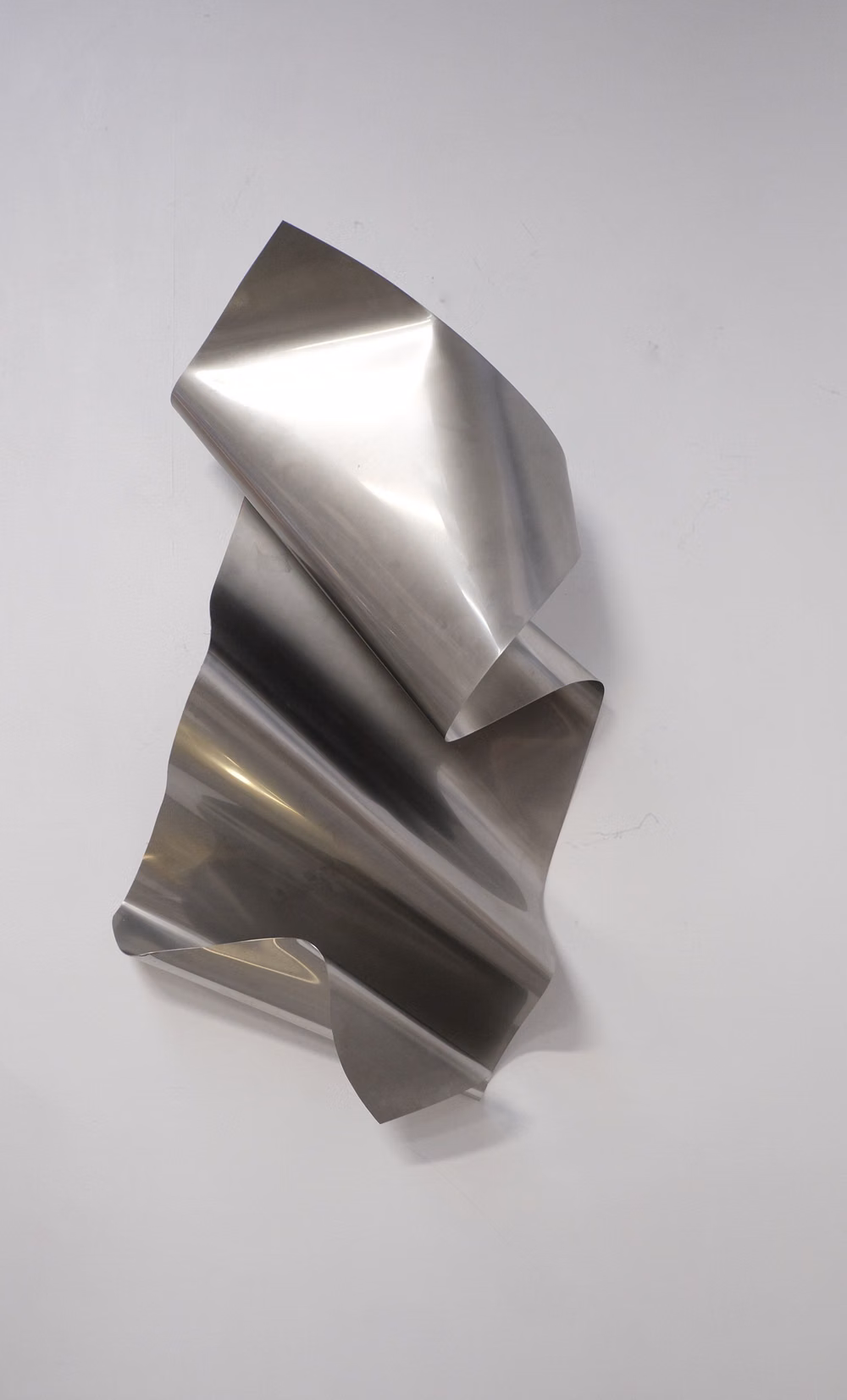 faceted folded metal surface photograph - FOLDS β THE VISUALS