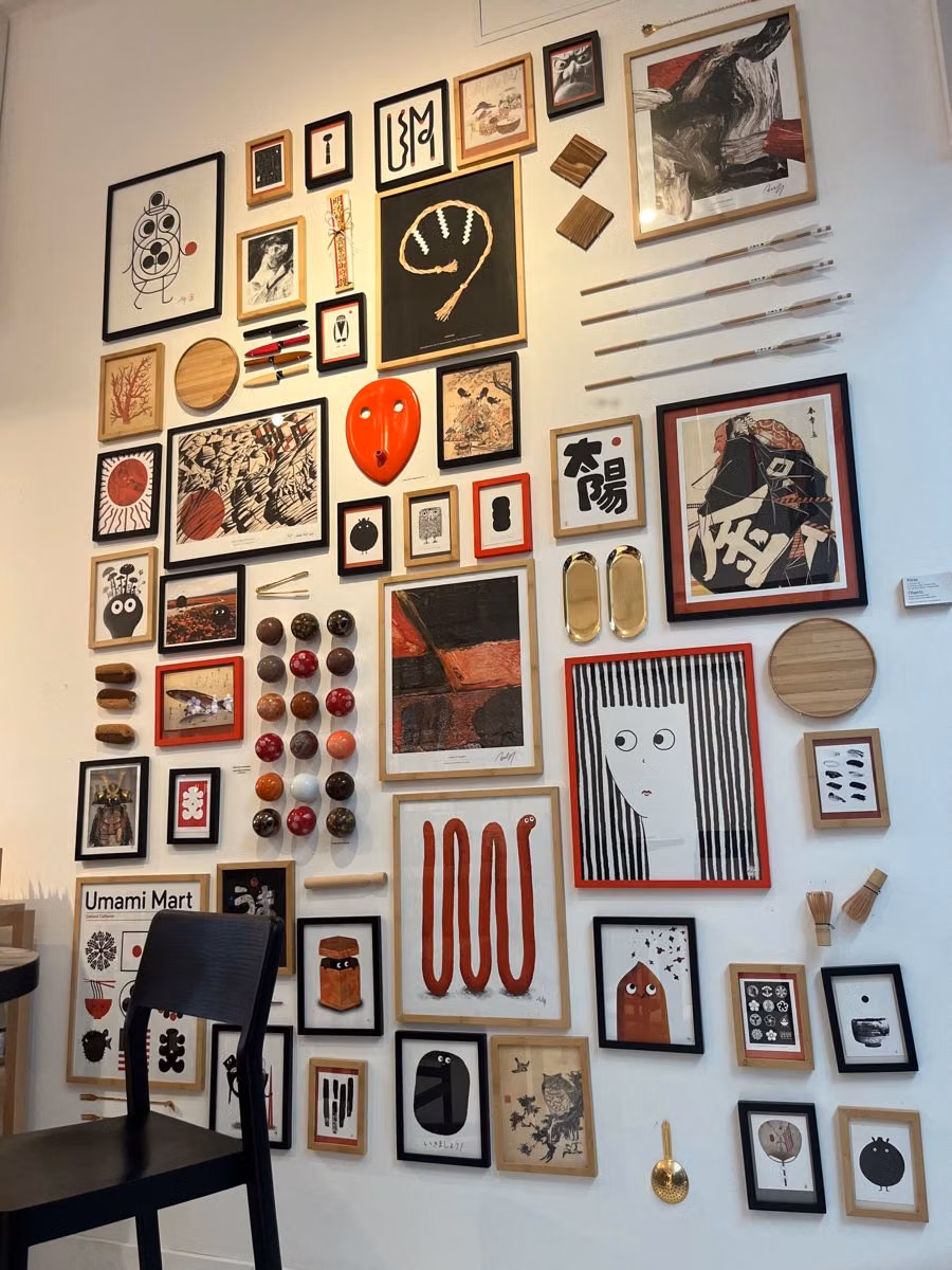 dense eclectic gallery wall interior photograph -