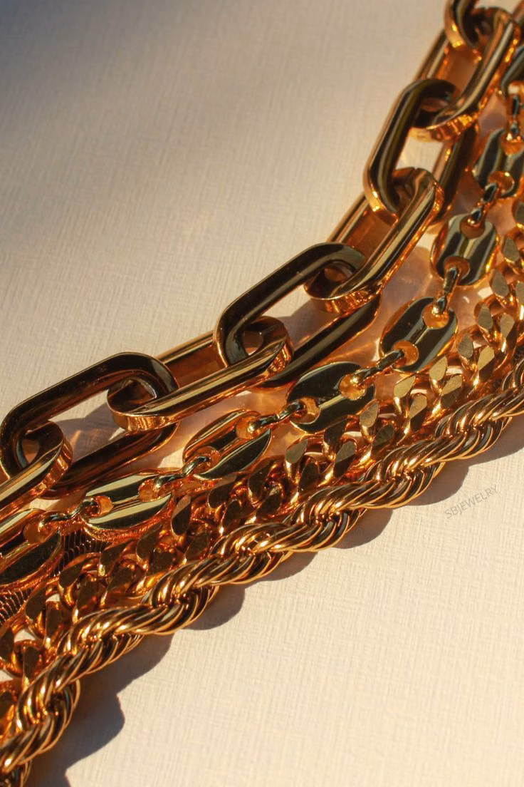 chunky gold rhinestone jewelry close up photograph -