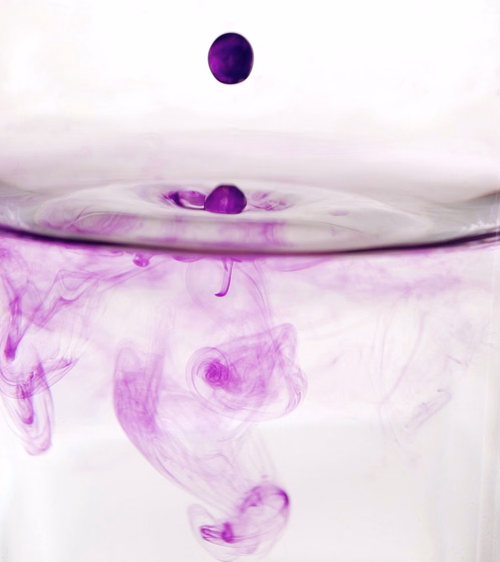 colored ink diffusion in water macro photograph -