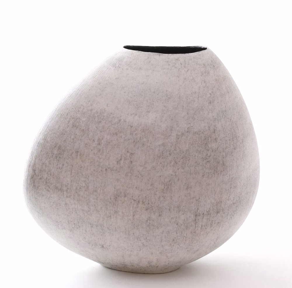 single unglazed ceramic vessel white background photograph -