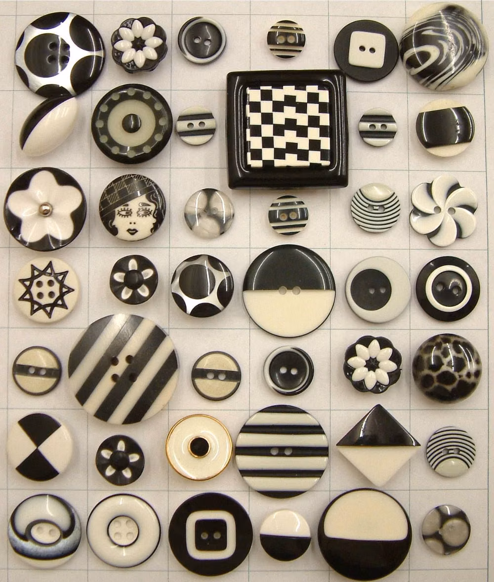 monochrome molded plastic buttons macro photograph -