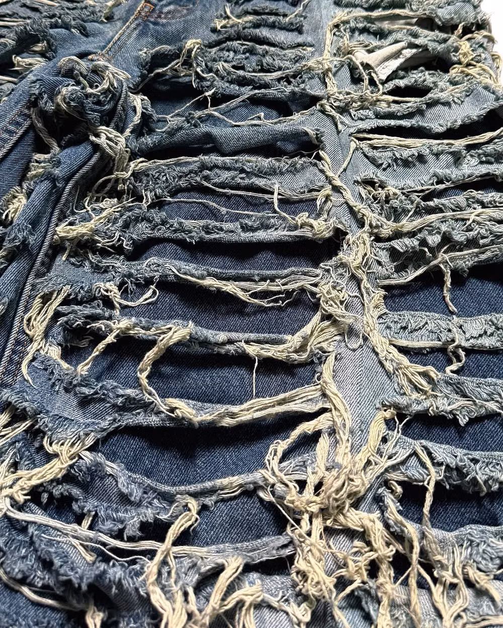 ripped denim fibers macro photograph - Punk And Saint 1of1 Hand-Painted Custom Piece 🌐 www.mainsaint.com