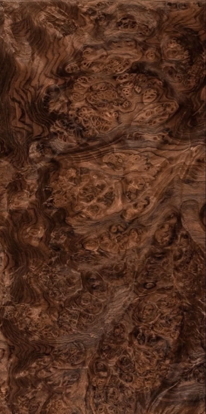 walnut burl wood grain macro photograph - 1 Piece of raw Walnut Burl veneer. Each premium high quality sheet is 9" wide by 18.75" long and 1/45" thick.  Walnut Burl is a beautiful and luxurious wood veneer, known for its eye catching color, incredible burls and figuring. There is NO ADHESIVE OR PAPER on the back side.