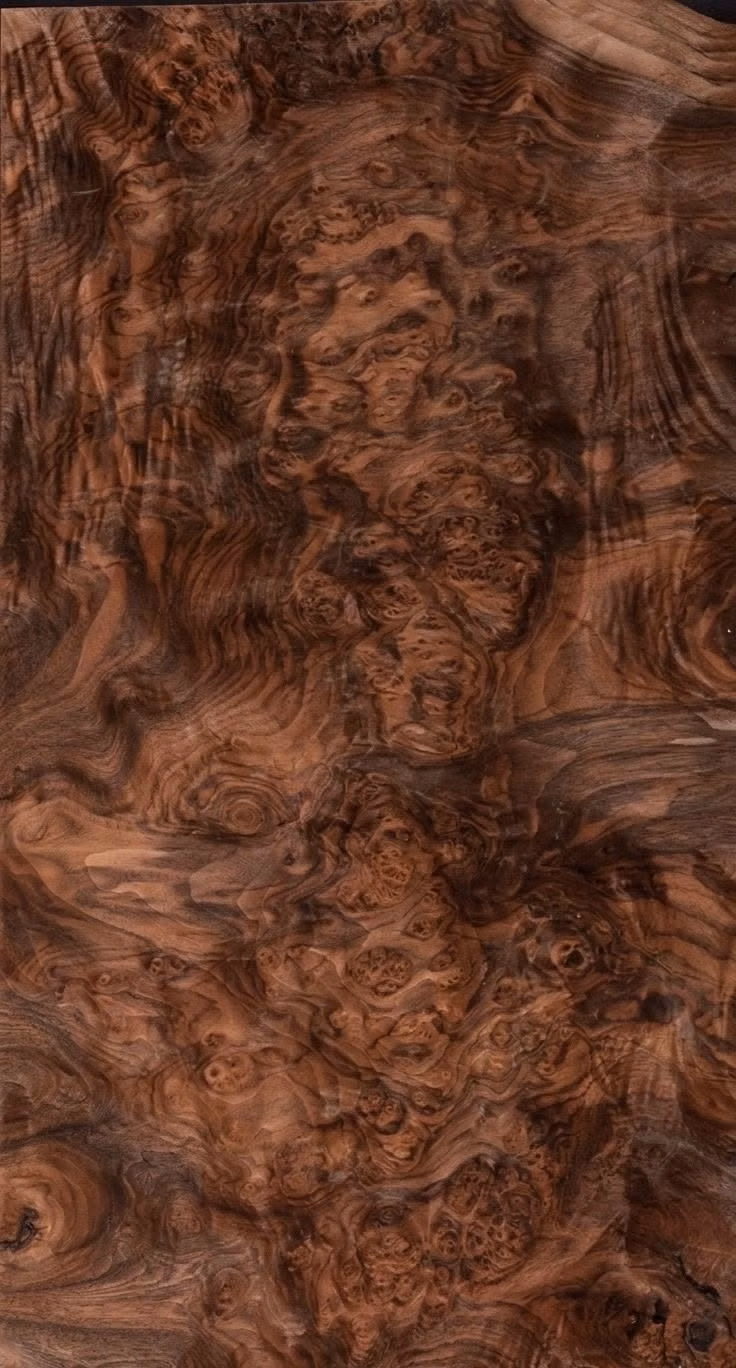 walnut burl wood grain macro photograph - 1 Piece of raw Exotic Walnut Burl veneer. Each premium high quality sheet is 16.25" wide by 33.5" long and 1/45" thick.  Walnut Burl is a beautiful and luxurious wood veneer, known for its eye catching color, incredible burls and figuring. There is NO ADHESIVE OR PAPER on the back side.