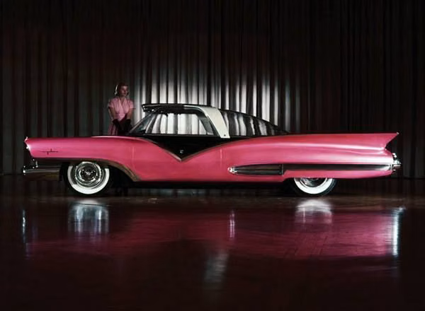 1950s futuristic concept car photograph - Ford Mystere Show Car, 1955  In September of 1955, Ford released photos of a futuristic body design for a car that would be propelled by a gas turbine powerplant. On display during the 1956 Chicago extravagaza, the prototype show car had no engine, although provisions were made to fit one under the rear deck. Cargo and spare tire were housed under the front hood. A large bubble of glass served as roof, windows and windshield. www.chicagoautoshow.com
