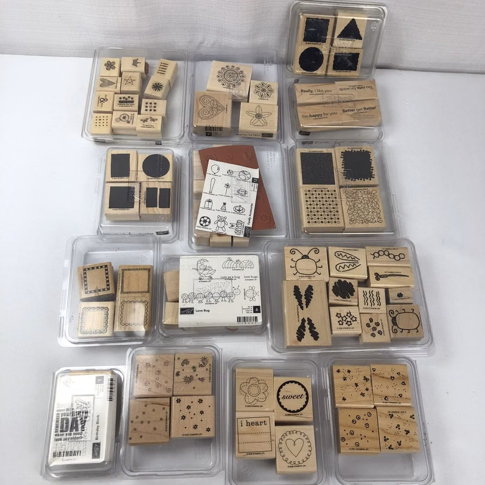 rubber stamp collection ink pads photograph - Huge Lot Of 78 Stampin' Up! Stamps - 14 Cases - Wood Mounted Rubber Stamps Mostly New Retired. Many Different Themes And Most Have Never Been Used. Some Are Still Unmounted. There Are 14 Stamp Cases With Stamps In Them. These Are Dated In The 1990's And The 2000's. Great Collection Of Stamps For The Crafter Out There. Sets Included Are: 1. Sweet On You 2. Love Bug 3. Birthday Block 4. Family Accessories 5. Shape Ups 6. Bug Builders 7. Beyond The Basics 8. Little Shapes 9. Quick Thinking 10. Taggers Dozen 11. Polka Dot Punches 12. Borders Mini 13. Fresh Fillers