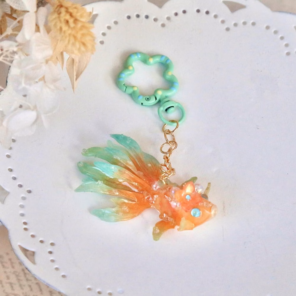 holographic fish charm macro photograph - π 250K Followers! π Thank you all so much for your incredible support! To celebrate, Iβm offering 20% off all items for the first 100 orders this week, including new items! πβ¨ If youβve ordered in the last 3 days, donβt worry β your price will be automatically matched. This is the biggest sale weβve ever had, and as a special thank you, every order this week will come with a high-quality jewelry bag. π Thank you once again for being amazing! Iβm so excited to continue this journey with you...