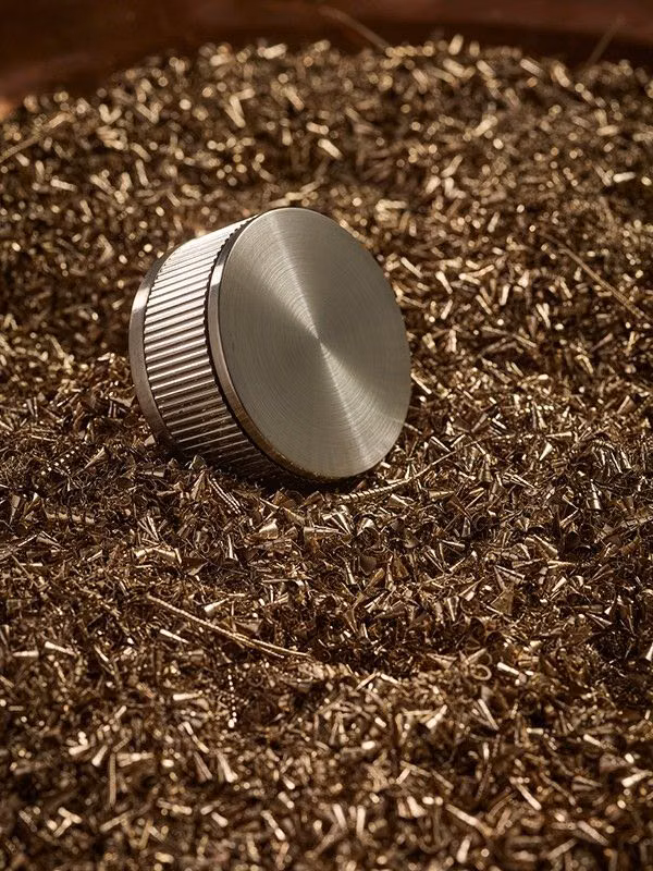 machined metal rotary knob macro photograph - In connection with our heritage we’re honouring where it all began — the vision that sparked our first ideas and the values that shaped our brand. Every product we create is built on that foundation, carrying forward the same craftsmanship, passion, and purpose that started it all. #coalbrookuk #bathroomdesign #bathroombrassware #brushedbrassbrassware #bathroominspo #interiordesign