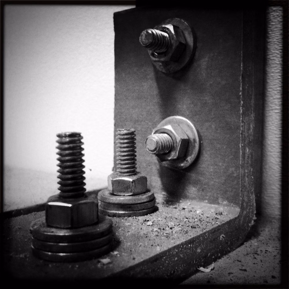 vintage slotted screws metal panel close up - Screws