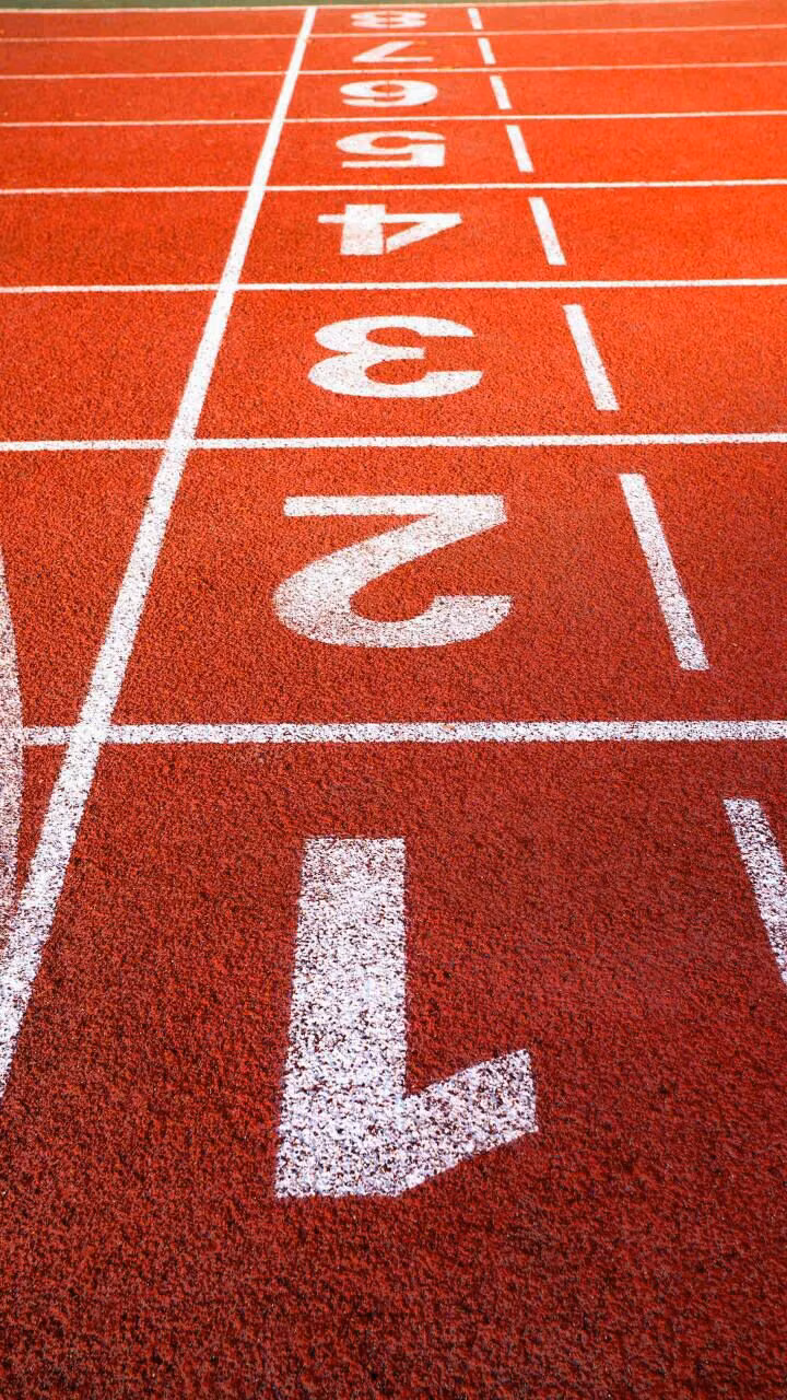 red rubber running track texture close up -
