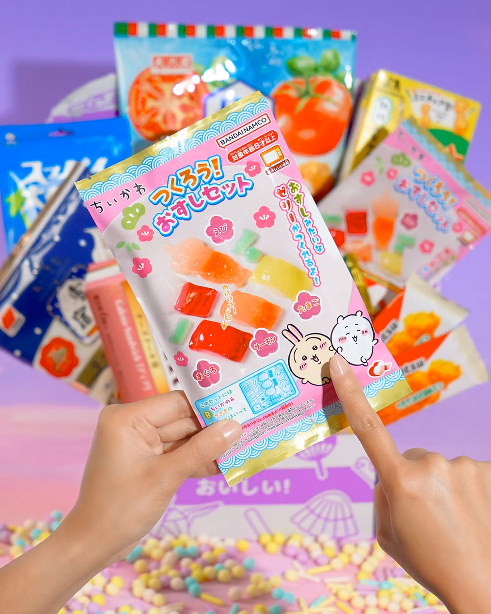 bright Japanese candy packaging photograph - Sushi made from candy? 🤯 Make some with Chiikawa and his buddies! 🍣🍱
We're celebrating our 100th Box this month, and we've packed this super cute DIY Candy Kit together with a MAJOR haul of other festival goodies. ⛩🍡🎎
Get yours in the link in the bio! 🔗