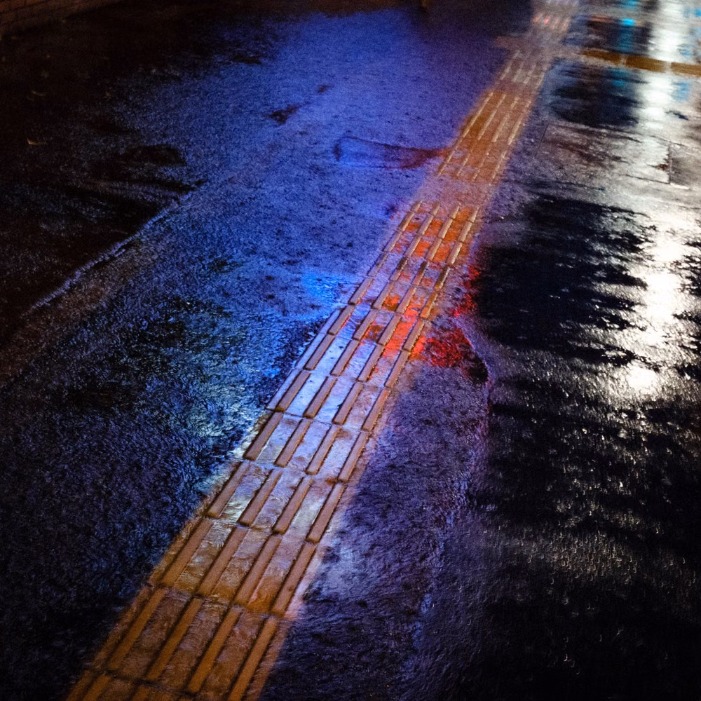 wet highway night neon reflections photograph -
