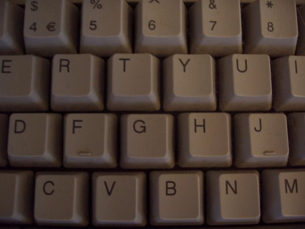 vintage computer terminal keyboard keys close up - computer keyboard